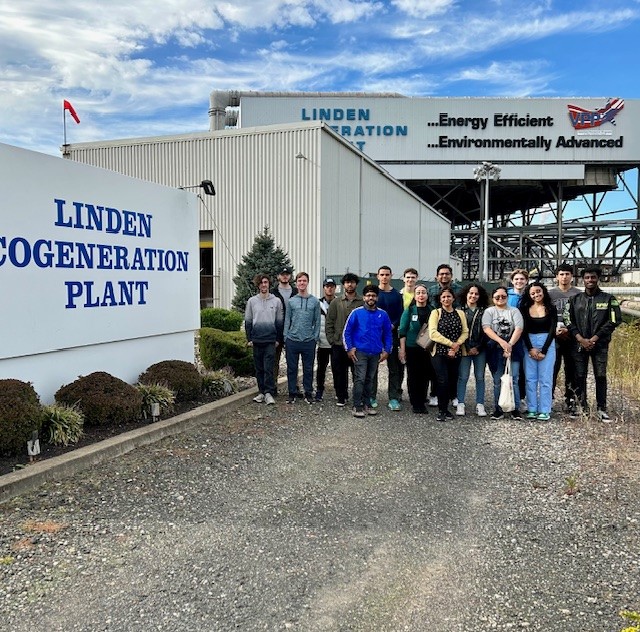 Stem Club students standing in front of the Linden Cogeneration plant.